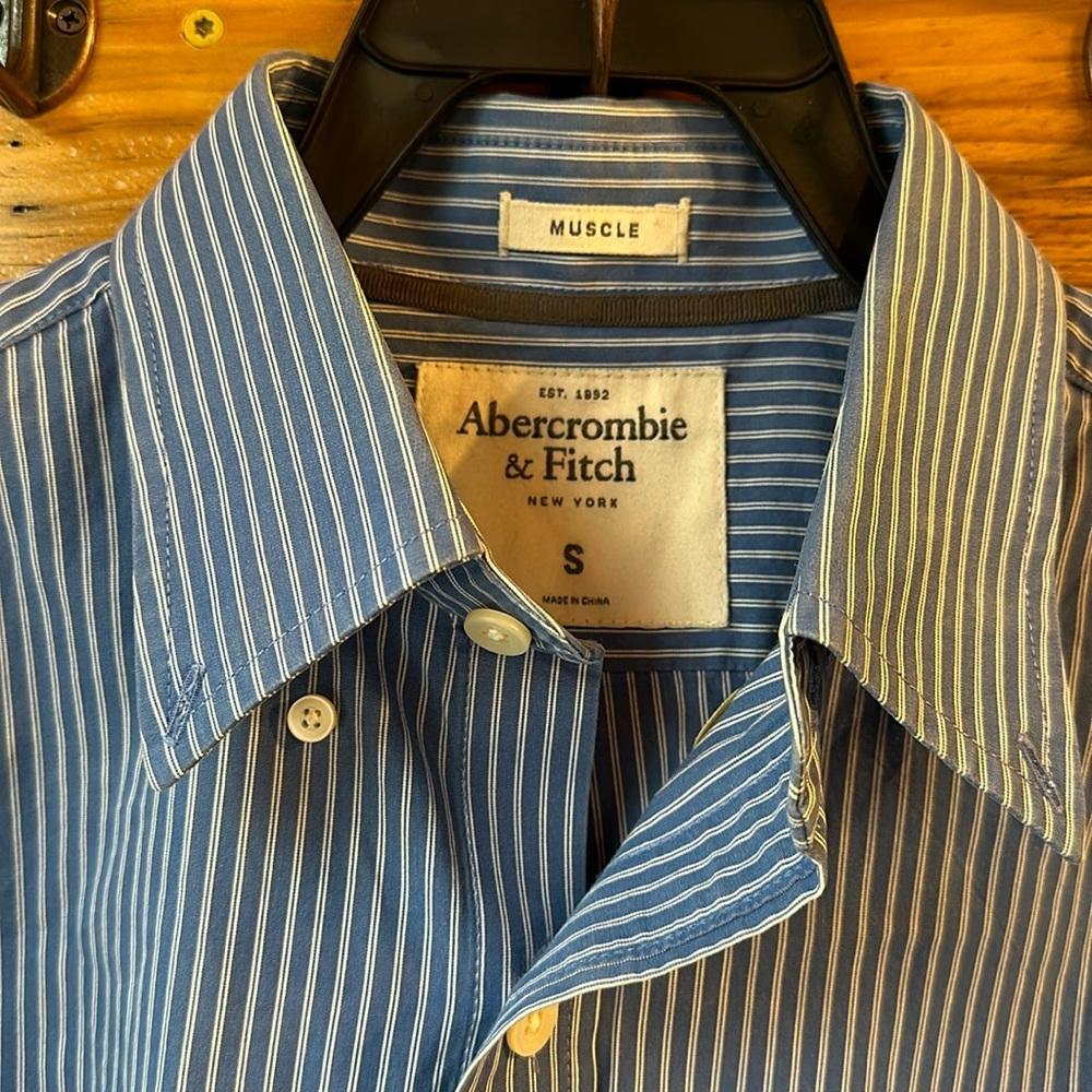 Men’s size small blue and white striped button down shirt.